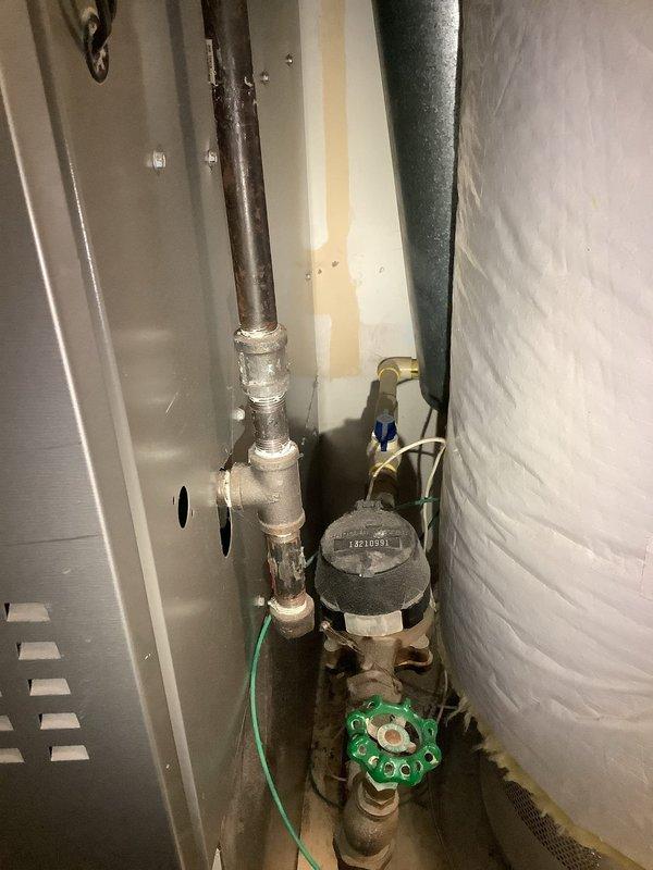 Completed estimate for whole house water pressure regulator installation and tanked water heater replacement. Assessed existing plumbing configuration including main water line valve assembly with pressure control components and current water meter location. Evaluated mechanical utility area constraints and existing pipe routing including copper supply lines and CPVC distribution piping. Inspected current water heater condition and venting requirements. Provided recommendations for pressure regulator placement at main water supply entry point and specifications for replacement water heater unit sized appropriately for household demand.