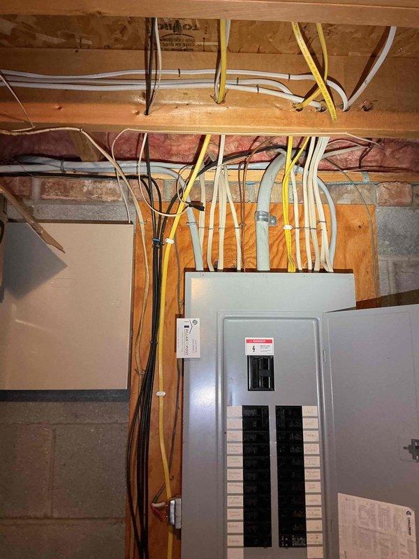 Completed electrical service for above-ground pool installation, including running electrical lines from main panel to pool equipment location. Assessed existing electrical panel capacity and circuit availability to support new pool equipment load requirements, with panel showing adequate breaker space for dedicated pool circuit installation.