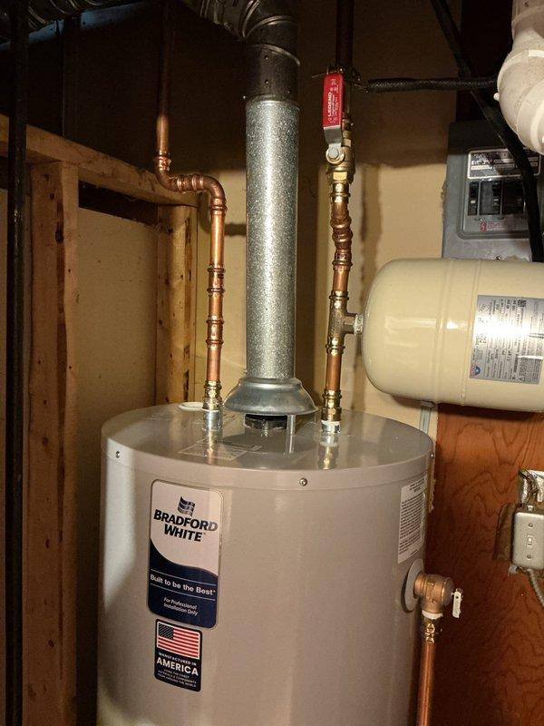 Responded to customer concern regarding bad smell from water in Bradford White tank water heater previously installed in January. Provided customer with installation booklet and documentation for their records. Performed visual inspection of water heater installation, verifying proper connections of copper supply lines, brass fittings, expansion tank, and venting system all remain in good working condition with no visible leaks or defects.