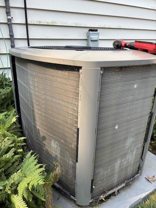 Completed MVP cooling maintenance visit on 3-year-old residential air conditioning system. Performed comprehensive inspection of outdoor condenser unit, including visual assessment of coil condition, cabinet integrity, and proper airflow clearance. Cleaned exterior grilles which showed moderate dirt accumulation and grime buildup. Verified unit levelness and checked refrigerant line connections. Inspected condensate drain pan for proper operation and cleared surrounding vegetation to maintain adequate clearance for optimal performance.