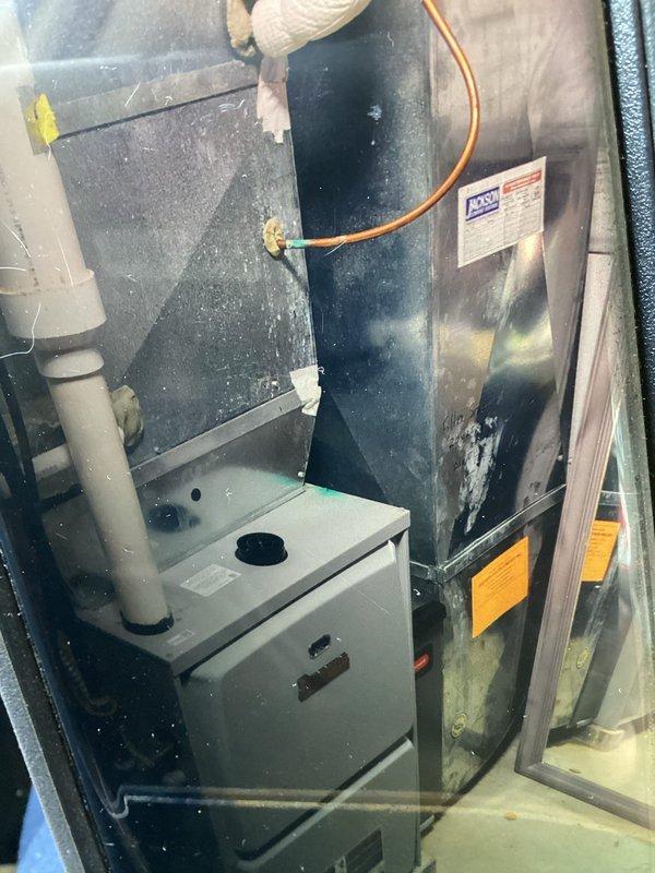 Responded to no cooling complaint on 6-year-old residential AC system struggling during heat wave. Upon inspection, found outdoor condenser unit operational but indoor air handler showed significant dust accumulation affecting airflow and system efficiency. Cleaned evaporator coil and blower assembly, removed debris from air handler cabinet, and verified proper refrigerant line connections. System restored to normal cooling operation with improved airflow and temperature differential across coil.