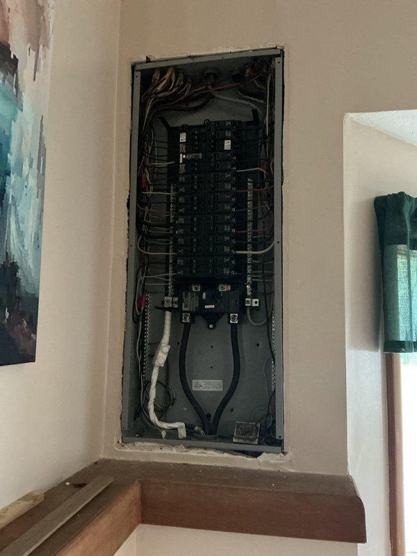 Responded to callback for heat pump circuit breaker repeatedly tripping. Inspected electrical panel and identified overload condition on dedicated HVAC circuit. Traced circuit to attic-mounted heat pump unit and discovered compromised wiring connections at equipment junction box causing excessive current draw. Tightened all electrical connections, verified proper amperage draw, tested circuit breaker operation, and confirmed system restored to normal operation without further tripping.