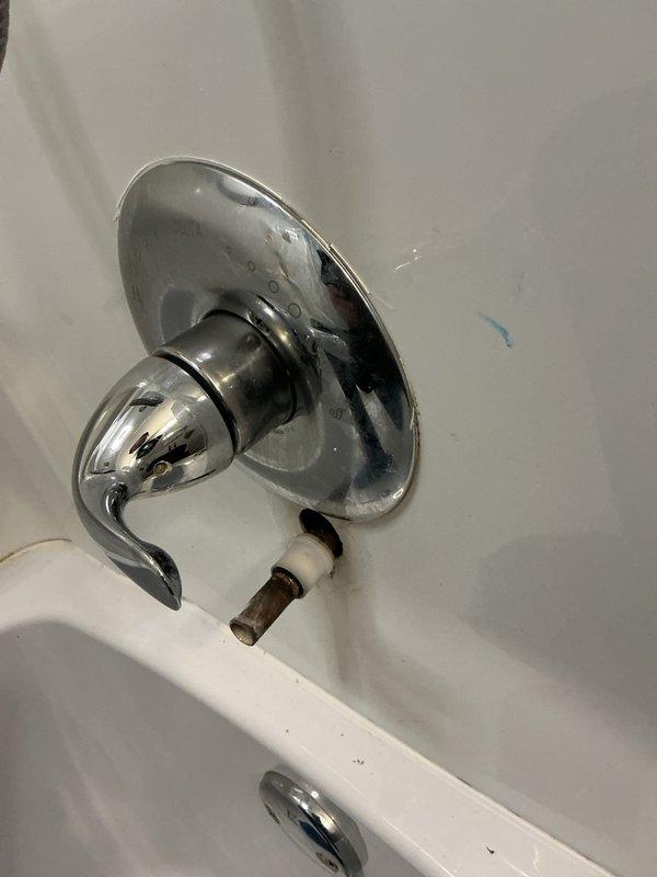 Replaced corroded bathtub spout assembly in 55-year-old residential bathroom. Removed existing chrome spout with rusted pipe connection and installed new fixture with proper wall mounting and sealing to prevent future water intrusion and corrosion.