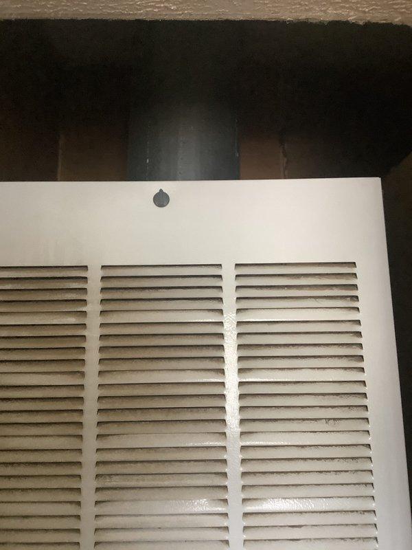 Completed HVAC system replacement estimate for mobile home installation. Assessed existing outdoor condensing unit positioned on ground-level pad adjacent to structure with electrical disconnect and conduit routing from exterior wall junction box. Evaluated interior return air grill and ductwork accessibility for complete system changeout specifications.