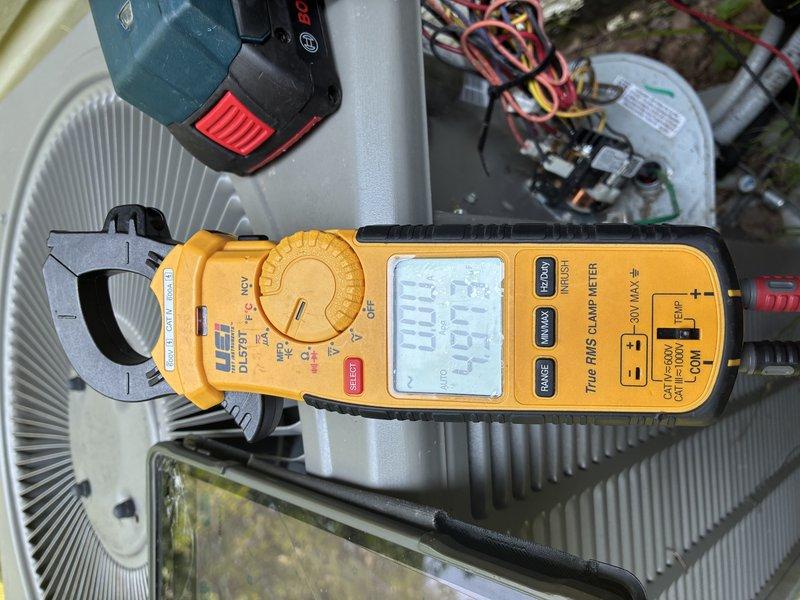 Completed comprehensive tune-up on 6-year-old residential air conditioning system. Performed electrical diagnostics using clamp meter to verify proper amperage draw and voltage levels at outdoor condensing unit, confirming system operating within manufacturer specifications. Inspected wiring connections, tested capacitor performance, and evaluated overall system operation to ensure optimal cooling efficiency for the season.