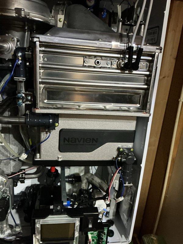 Performed annual maintenance and flush service on Navien tankless water heater. Descaled heat exchanger, cleaned inlet filter screen, inspected all plumbing connections and electrical components, and verified proper operation. Unit tested and confirmed functioning within normal parameters upon completion.