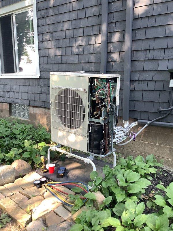 Responded to service call for three non-operational mini split systems. Upon arrival, performed diagnostic evaluation of outdoor condensing units and refrigerant line sets, which showed signs of aging with oxidized copper piping and worn insulation. Accessed internal components of exterior unit by removing side panel to inspect compressor, coils, electrical connections, and refrigerant lines. Connected manifold gauges to assess system pressures and refrigerant charge levels. Documented equipment condition through photographs showing deteriorated line set insulation, corroded fittings, and overall system wear. Customer was advised of findings and potential solutions for restoring system operation.