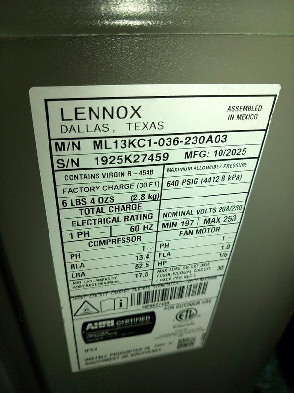 Completed installation of Lennox ML13KC1-036-230A03 air conditioning system with matching evaporator coil in interior mechanical room. Unit was charged with R-454B refrigerant per factory specifications at 6 lbs 4 oz total charge weight. Installed condensate drain lines using white PVC piping with proper pitch and termination, verified all electrical connections at 208/230V single-phase service, and secured all ductwork connections with foil tape. System was tested for proper operation and all manufacturer labels remain visible for future service reference.
