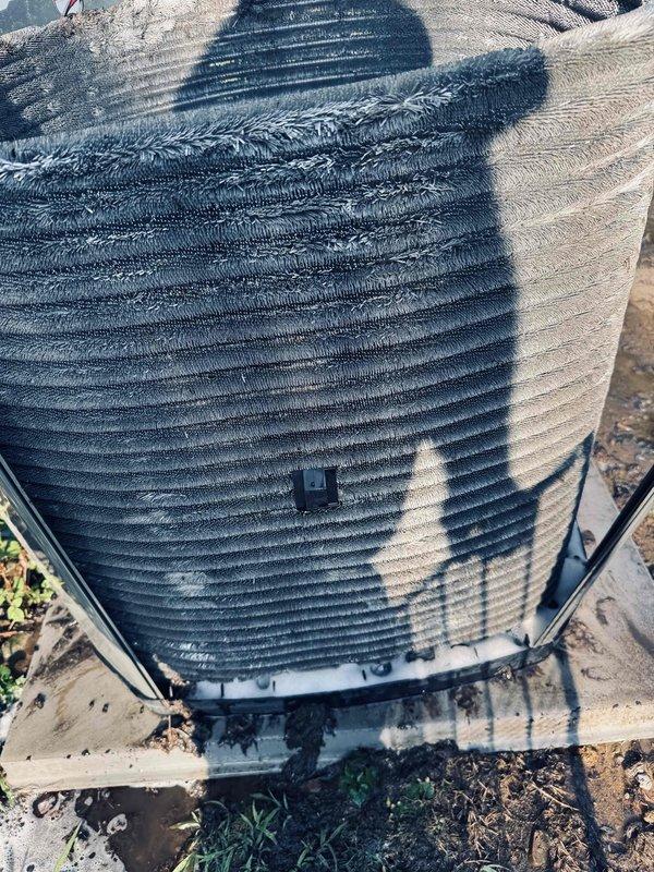 Responded to service call for non-operational air conditioning unit that had been relocated due to recent sewer line excavation work. Performed thorough inspection of outdoor condenser unit and indoor evaporator coil to verify proper reconnection and identify any issues resulting from the relocation. Found outdoor condenser unit properly positioned on concrete pad with refrigerant lines intact. However, discovered indoor evaporator coil heavily contaminated with excessive dust and debris accumulation, significantly restricting airflow and system performance. The dense buildup on coil fins indicated prolonged maintenance neglect that predated the unit relocation. Documented unit condition through photographs showing both outdoor condenser assembly and severely fouled indoor coil. Confirmed all electrical connections and refrigerant lines were properly secured following the move, with no apparent damage from relocation activities.