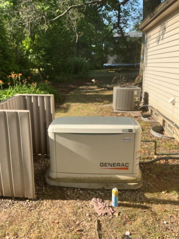 Performed scheduled maintenance on a 5-year-old 14kW Generac residential standby generator. Conducted comprehensive inspection of unit including checking oil level, air filter condition, battery voltage, and overall system operation. Verified proper function of automatic transfer switch and confirmed generator started successfully during test cycle. All components found to be operating within normal parameters, with green indicator light showing system ready status.