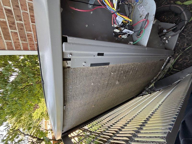 Completed comprehensive AC tune-up on five-year-old system, including inspection of outdoor condenser unit and indoor air handler components. Removed access panel to examine electrical connections, capacitor, and relay; all wiring properly secured and connections intact. Discussed annual maintenance plan enrollment with customer.