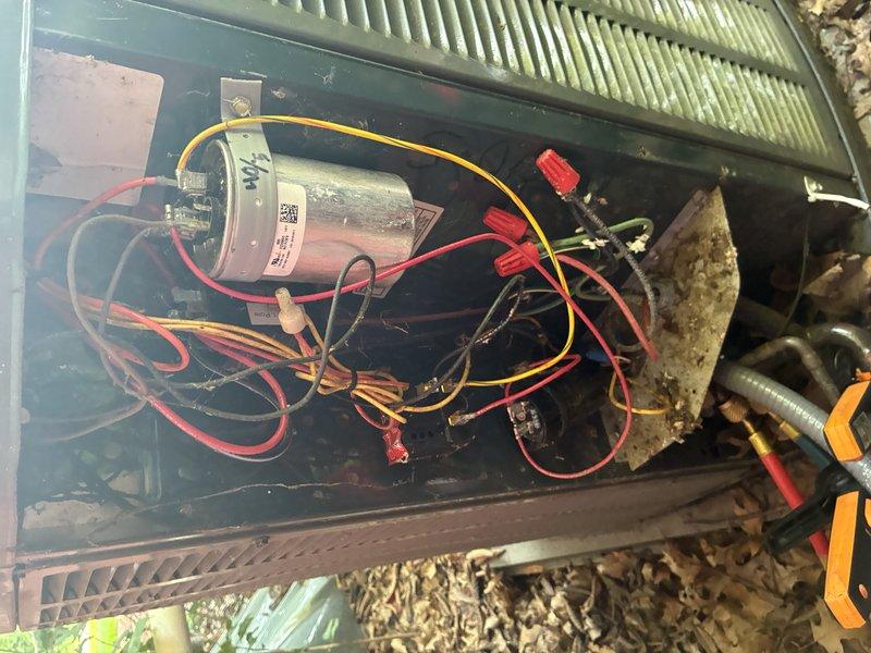 Performed preventive maintenance inspection on 12-year-old air conditioning system. Inspected electrical compartment including capacitor and wiring connections, verified all connections secure with no signs of wear or damage. Evaluated blower wheel assembly and noted dust accumulation on fins and housing, typical for unit's age and operation. All components functioning within normal parameters at time of inspection.