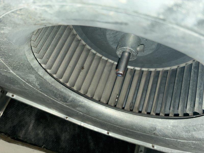 Performed preventive maintenance inspection on 12-year-old air conditioning system. Inspected electrical compartment including capacitor and wiring connections, verified all connections secure with no signs of wear or damage. Evaluated blower wheel assembly and noted dust accumulation on fins and housing, typical for unit's age and operation. All components functioning within normal parameters at time of inspection.