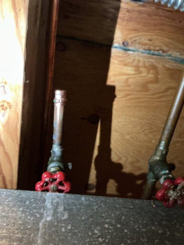 Replaced both exterior hose spigots with frost-free units to bring the installation up to current plumbing code. Removed existing gate valves and installed new quarter-turn ball valves for improved shutoff reliability. Ran new copper supply lines from the ball valves to the frost-free spigots, utilizing proper soldering techniques at all joints and connections. Secured both spigot assemblies to the exterior wall with appropriate mounting hardware and sealed all penetrations through the siding to prevent water intrusion and air leakage.