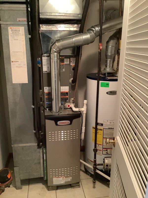 Completed installation of 80% efficiency Lennox furnace and air conditioning system. Installed new furnace unit with proper ductwork connections and routing, mounted electrical disconnect box with 20-amp Littelfuse fuses for equipment protection, and established all necessary electrical connections to panel. Configured supply plenum with metal ductwork extending from furnace with appropriate segmented flexible joints for proper air distribution. Verified all equipment clearances meet manufacturer specifications and code requirements. System tested and operational upon completion.