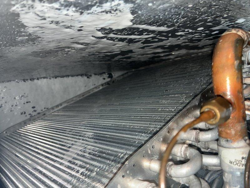 Performed preventative maintenance on indoor air handling unit including evaporator coil cleaning to remove accumulated dust and debris. Installed drain line treatment tablets to prevent algae buildup and maintain proper condensate drainage, and added surge protection device to safeguard system components from electrical damage.