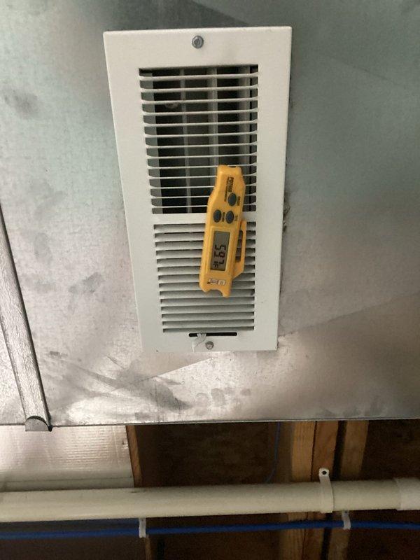 Responded to no cooling complaint on 6-year-old residential air conditioning system with indoor temperature at 80°F. Performed diagnostic testing at supply register using digital meter to measure airflow and temperature differential. Inspected Lennox furnace and air handler assembly in mechanical room, checking electrical connections, control board operation, and refrigerant lines. System had received maintenance service several months prior but ceased cooling operation recently, requiring troubleshooting to identify root cause and restore proper cooling function to residence.