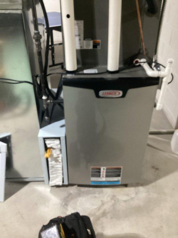 Responded to no cooling complaint on 6-year-old residential air conditioning system with indoor temperature at 80°F. Performed diagnostic testing at supply register using digital meter to measure airflow and temperature differential. Inspected Lennox furnace and air handler assembly in mechanical room, checking electrical connections, control board operation, and refrigerant lines. System had received maintenance service several months prior but ceased cooling operation recently, requiring troubleshooting to identify root cause and restore proper cooling function to residence.