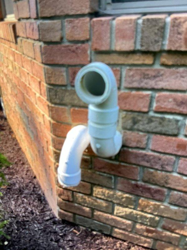 Return visit to diagnose ongoing issues with recently installed tankless water heater system. Initial assessment suspected gas pressure regulator at meter, but utility company confirmed regulator was functioning properly. Continued diagnostic procedures to identify root cause of performance issues. Inspected PVC venting system extending from exterior brick wall, including intake and exhaust terminations. Further troubleshooting required to isolate problem and determine appropriate corrective action.
