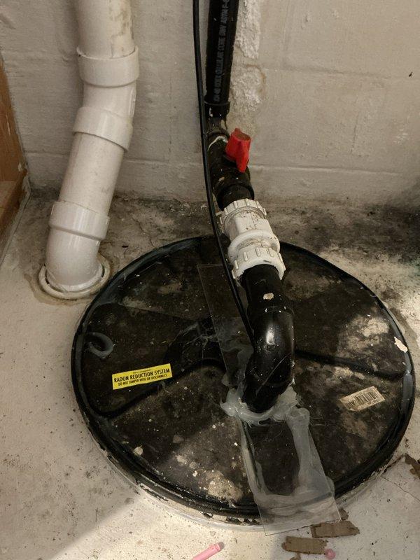 Responded to service call for non-functional sump pump producing grinding noise. Upon inspection, found sump pump basin with integrated radon reduction system requiring special handling. Carefully removed and documented sealed cover connected to radon mitigation piping to access failed pump unit. Assessed pump condition and determined replacement necessary due to mechanical failure. Provided comprehensive quote for sump pump replacement, ensuring new installation will maintain proper integration with existing radon system and require professional resealing of basin cover upon completion to preserve radon mitigation effectiveness.