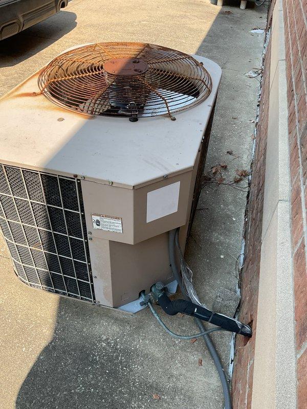 Responded to no cooling complaint on 21-year-old outdoor condensing unit. Upon arrival, verified unit was running but not producing cold air. Performed diagnostic inspection of condenser components including compressor operation, fan motor function, and refrigerant system. Assessed condition of aging equipment showing significant weathering and operational wear consistent with age. Evaluated electrical connections, capacitor performance, and airflow through condenser coil. Due to advanced age of system and extent of service requirements, provided customer with repair options and recommendations for system replacement given equipment has exceeded typical service life expectancy. Applied friends and family discount as requested.