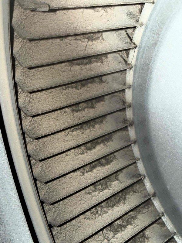 Responded to customer complaint of high humidity and inadequate cooling. Upon inspection, found extensive frost and ice buildup on supply grille and evaporator coil assembly, indicating restricted airflow or low refrigerant charge causing coil to freeze. Documented frozen conditions with photos showing severe ice accumulation on ventilation components and visible moisture on ductwork connections in mechanical space.