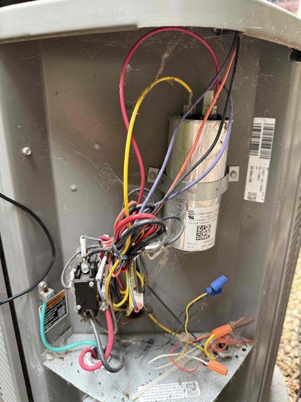 # HVAC Maintenance - Cooling Service Completed

Performed comprehensive MVP cooling maintenance visit on residential HVAC system. Conducted thorough inspection of all interior components including blower assembly, control module, and multiple circuit boards. Verified proper electrical connections throughout the system, inspecting multicolored wiring harnesses and terminal blocks for secure connections and signs of wear.

Examined the control panel enclosure and capacitor for proper operation. Cleaned accumulated dust and debris from the base of the unit and interior compartments. Performed leak check on refrigerant system per customer request, focusing on area that was previously repaired last year. All connections, coils, and refrigerant lines inspected for signs of leakage. System found to be operating within normal parameters with no active leaks detected. Unit tested and confirmed to be functioning properly upon completion of maintenance visit.