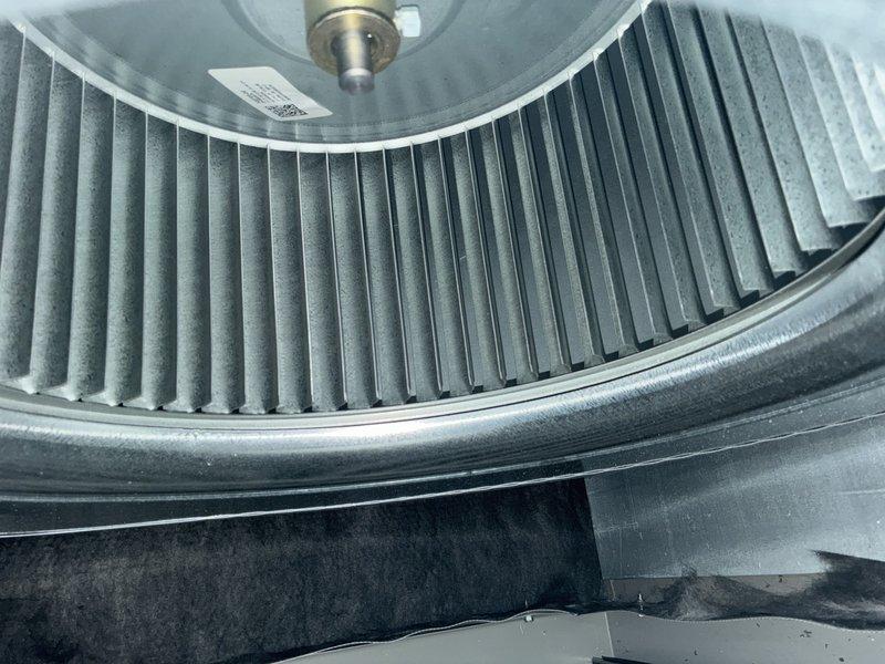 Completed annual maintenance on one-year-old air conditioning system. Inspected blower assembly and found normal operational wear with minor dust accumulation on wheel and housing. Verified electrical connections at capacitor and associated wiring, confirmed all components secure and functioning within specifications.
