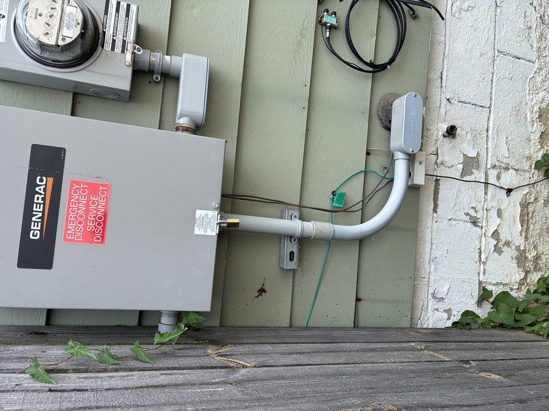 Performed on-site evaluation of existing Generac generator electrical installation for potential relocation project. Documented current generator transfer switch configuration, including electrical panel connections, meter base assembly, and conduit routing on exterior wall. Assessed existing PVC conduit runs, disconnect hardware, and integration with utility service entrance to determine scope of work required for relocating generator system to accommodate planned building addition. Customer requesting formal estimate for generator relocation services.