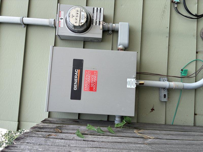 Performed on-site evaluation of existing Generac generator electrical installation for potential relocation project. Documented current generator transfer switch configuration, including electrical panel connections, meter base assembly, and conduit routing on exterior wall. Assessed existing PVC conduit runs, disconnect hardware, and integration with utility service entrance to determine scope of work required for relocating generator system to accommodate planned building addition. Customer requesting formal estimate for generator relocation services.