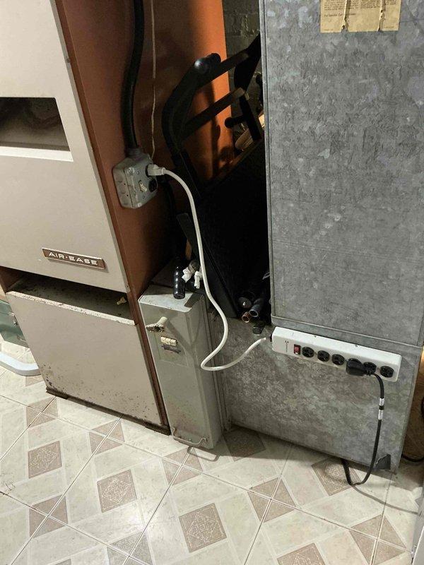 Conducted on-site evaluation for complete HVAC system replacement, including furnace and air conditioning unit. Assessed existing equipment in mechanical room, documenting current Airware furnace installation and associated electrical components showing signs of age and wear. Evaluated exterior condensing unit location and accessibility for replacement equipment, noting adequate clearance and existing electrical service routing. Provided comprehensive replacement estimate covering both heating and cooling equipment to customer.