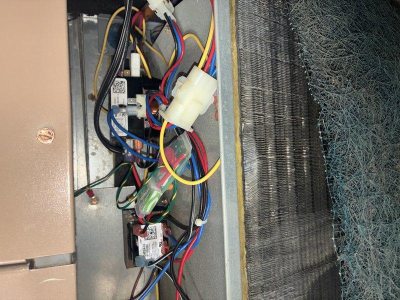 Completed MVP cooling maintenance visit on 7-year-old HVAC system. Performed standard inspection of condenser coil, electrical components, and control wiring; all connections secure and operational. Unit operating within normal parameters; documented system condition with photos for service records.