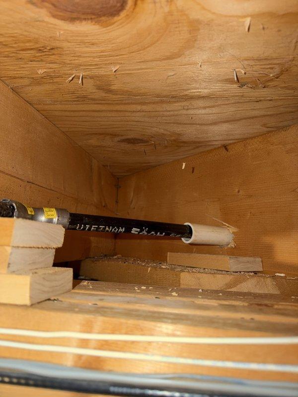 Installed a new 1/2-inch gas line in the basement, tying into the existing 1-inch main gas line near the furnace. Routed the line through the basement structure, stubbed it out through the back of the home, and terminated it with a shut-off valve for outdoor gas grill connection.