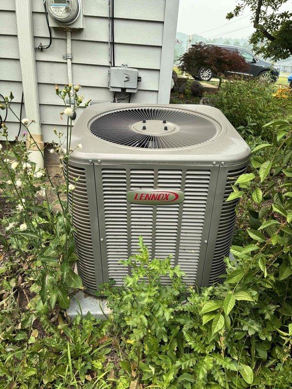 Completed cooling maintenance on Lennox outdoor condensing unit. System operating properly with adequate refrigerant charge and proper temperature differential. Evaporator coil showing normal frost pattern, and all components functioning within manufacturer specifications to ensure reliable performance during peak cooling season.