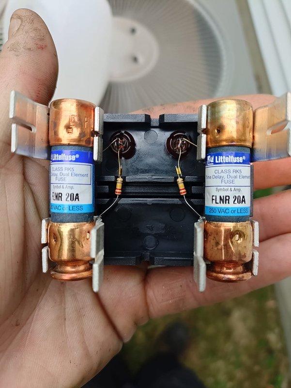 Completed installation of 80% efficiency furnace and air conditioning system. Installed new electrical disconnect with Littelfuse Class RK5 FLNR 20A dual element time delay fuses rated for 250 VAC, ensuring proper overcurrent protection for the system. Mounted junction box on equipment with proper wire management using braided conduit sleeving for conductor protection. Connected flexible metallic condensate drain line and verified proper drainage. All electrical connections secured to manufacturer specifications, system tested and operational.