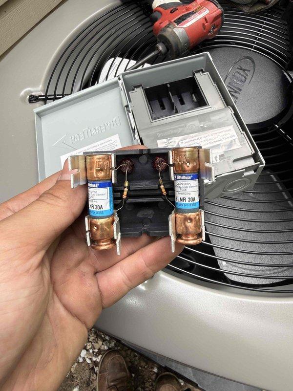Completed installation of WeatherKing air conditioning system with matching evaporator coil. Installed outdoor condenser unit on protective pad with proper clearances, established refrigerant line connections, and wired electrical disconnect with 30-amp Bussmann fuses for overcurrent protection. System tested and operational.