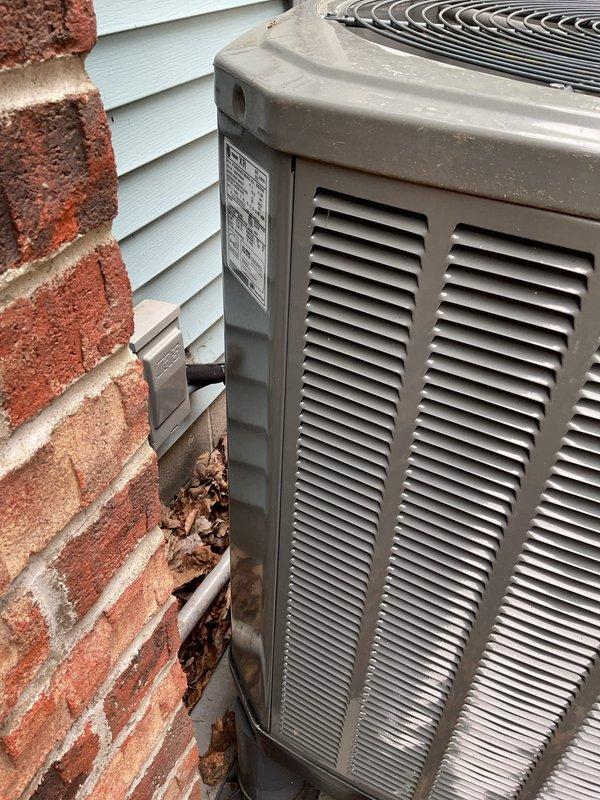Completed routine maintenance on an 11-year-old heat pump system. Performed standard tune-up procedures including inspection of outdoor condenser unit, verification of refrigerant lines, and assessment of overall system operation. Unit showed normal wear for age with some debris accumulation around base that was noted during service visit.