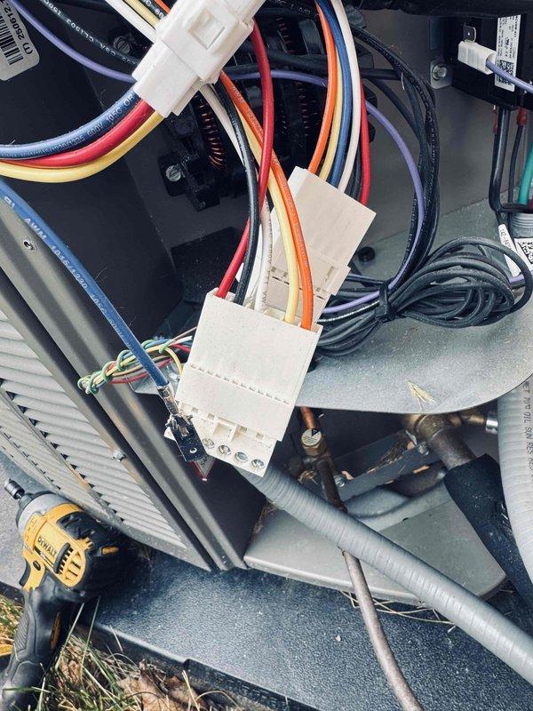 Responded to no-cooling call on residential central air conditioning system with intermittent failure. Upon inspection, identified faulty control board connections and loose wiring at outdoor unit. Secured all wire terminals at PCB connection points, verified proper seating of communication connectors (CN-COMM), and tested control board functionality. Cycled system through multiple cooling cycles to confirm reliable operation and proper thermostat communication. Unit now cooling effectively and maintaining setpoint temperature.