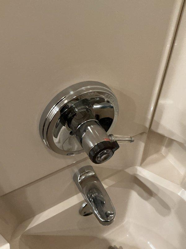 Responded to service call for multiple plumbing issues including two faucets requiring repair. Kitchen faucet addressed for active leak; bathroom faucet repaired for loose handle operation. Inspected two drain systems: one drain evaluated for potential obstruction requiring future snaking service, main bathroom drain assessed for clog condition. Examined water filtration system housing fittings for proper function and connection integrity. Evaluated expansion tank for potential air infiltration issues affecting system pressure regulation. Documented conditions with photographs of kitchen sink faucet assembly with pull-down sprayer and bathroom tub/shower valve with single-handle control.