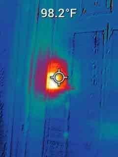 Responded to service call for 11-year-old Trane central air conditioning unit experiencing repeated breaker trips and system shutdowns. Upon arrival, performed diagnostic testing using thermal imaging to identify hot spot measuring 98.2°F at electrical connection point, indicating excessive resistance or loose connection. Utilized digital multimeter to verify electrical readings and confirm abnormal amperage draw of 12.93 amps at affected circuit. Identified failing contactor and compromised wiring as root cause of breaker trips. Repaired electrical connections, replaced defective contactor, and installed new programmable thermostat per customer request. Tested system operation through complete cooling cycle, verified proper amperage draw, and confirmed no further breaker trips. Unit restored to normal operating condition with stable electrical performance.