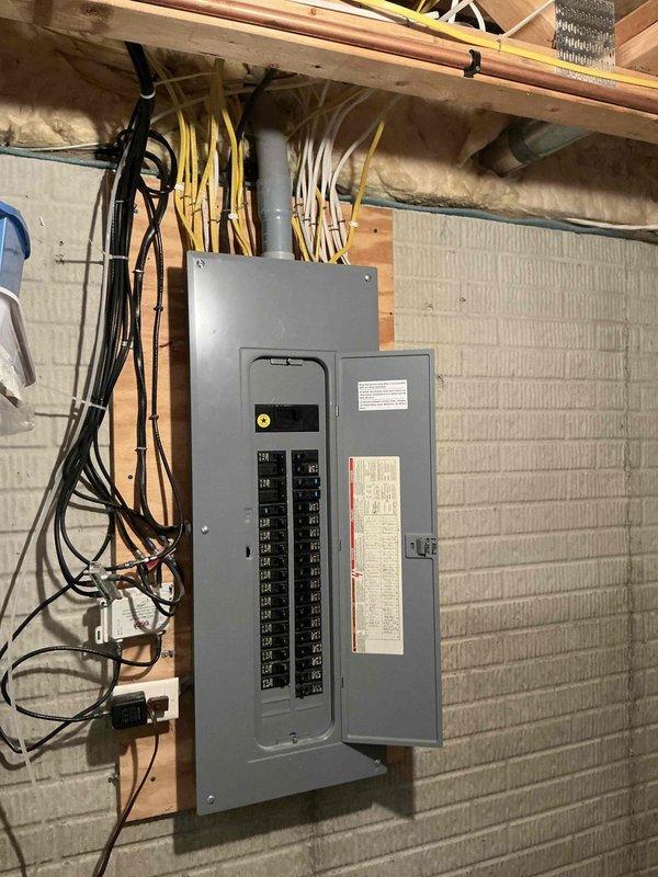 Conducted on-site evaluation for Generac whole-home generator installation. Assessed existing electrical infrastructure, including main service panel and available capacity for generator integration. Documented current electrical panel configuration showing circuit breaker arrangement and available spaces for transfer switch installation. Evaluated installation location requirements and determined optimal placement for automatic standby generator unit. Reviewed electrical load requirements and confirmed compatibility with homeowner's power needs. Photographed existing electrical system to support equipment sizing and installation planning. Discussed available promotional financing options with homeowner to facilitate project approval.