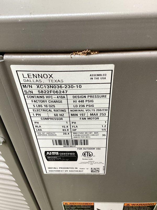 Completed preventive maintenance cooling visit on 3-year-old Lennox XC13N036-230-10 unit charged with 5 lbs 10 oz of HFC-410A refrigerant. Inspected electrical disconnect box with fuses, verified all electrical connections secure, and documented unit specifications and current operating condition through photos of manufacturer nameplate and disconnect assembly.