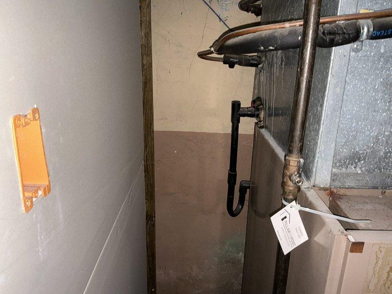Completed comprehensive assessment of existing HVAC system experiencing no cooling condition and whistling sound concerns. Evaluated beige furnace unit with integrated air handler/humidifier, noting visible interior burner discoloration and signs of wear throughout the system. Documented existing ductwork configuration with metallic supply and return runs showing dust accumulation and age-related deterioration. Assessed copper refrigerant lines, black gas piping, and associated plumbing connections in basement utility space. Provided detailed replacement estimate for complete furnace and air conditioning system upgrade to address cooling failure and operational noise issues while improving overall system efficiency and reliability.