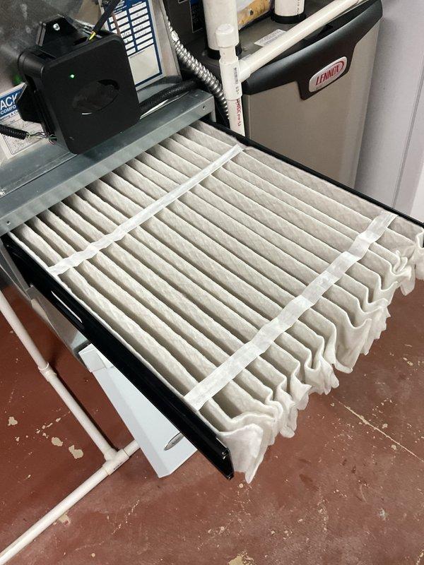 Completed preventative maintenance on one-year-old Lennox HVAC system. Inspected air handler unit, accessed and evaluated pleated air filter which showed moderate dust accumulation, and verified all system components including ductwork, gas connections, and control panel were operating within normal parameters.