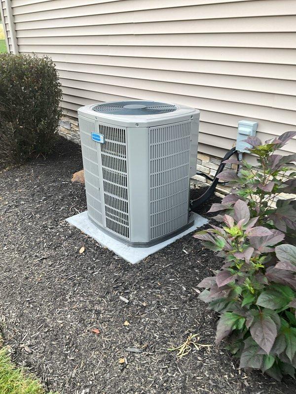 Responded to service call for 2-year-old American Standard air conditioning system experiencing loud noise during startup and shutdown cycles affecting entire residence. Upon arrival, performed visual inspection of outdoor condenser unit and removed access panel to examine electrical components. Tested capacitor under load conditions and verified proper microfarad ratings and voltage specifications. Inspected contactor operation, evaluated all wire connections for tightness and signs of arcing or heat damage, and checked refrigerant line connections. Determined system was operating within normal parameters; advised customer that startup and shutdown noise can be characteristic of certain compressor designs and confirmed no immediate component failures were present. All electrical connections were secure, capacitor tested within acceptable range, and contactor showed proper operation. Reinstalled access panel and restored unit to service.