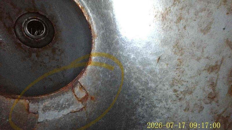 Responded to no cool call on 19-year-old air conditioning system. Upon arrival, confirmed unit was running but not producing cold air. Conducted diagnostic inspection revealing severely corroded evaporator coil with visible rust deterioration around access ports and seams, indicating refrigerant leak and extensive age-related degradation. Documented equipment condition with photos showing significant corrosion, rust staining, and compromised metal integrity on coil housing and ductwork connections. Due to advanced age of system and extent of deterioration, recommended full system replacement as most cost-effective solution versus repair of failed components.