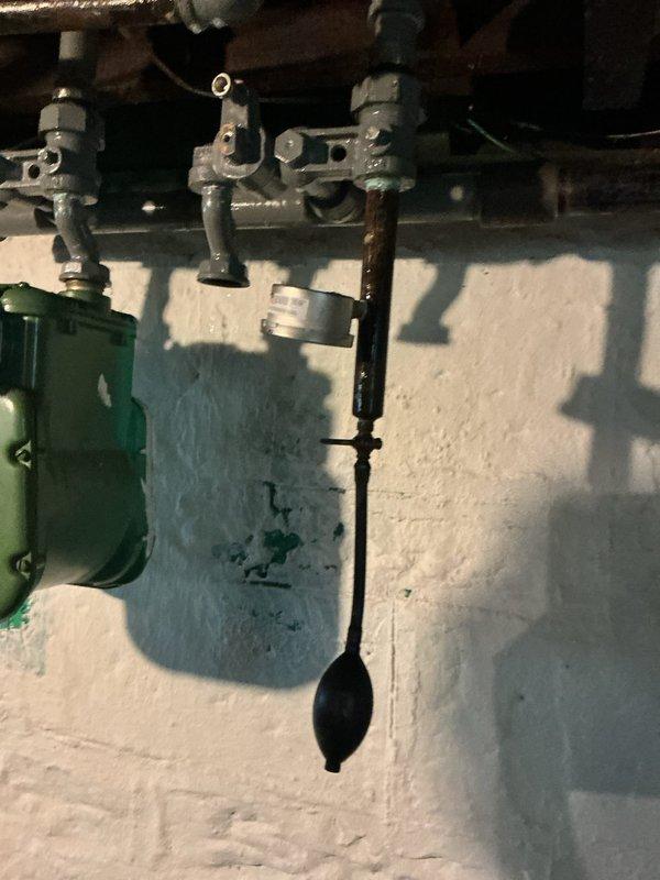Performed air pressure test on residential gas piping system to verify system integrity and identify any potential leaks. Inspected gas line valves, fittings, and connections throughout the system, including main shut-off valves and branch line components in the basement utility area. Test confirmed system held pressure within acceptable parameters, with no parts requiring replacement or repair at this time.