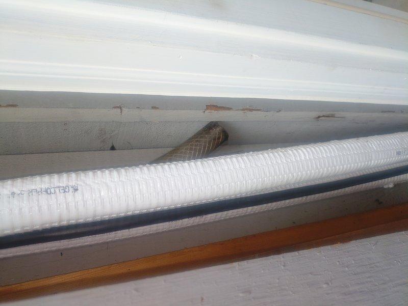 Performed follow-up inspection on recently installed mini split system to address outstanding installation issues. Documented missing cover components, unlevel unit positioning, and improper routing of refrigerant lines and condensate drain requiring cleanup and securing. Identified concerns with protective cover installation over condenser coil fins that may impact airflow and serviceability, recommending corrective measures to ensure optimal system performance and compliance with manufacturer specifications.