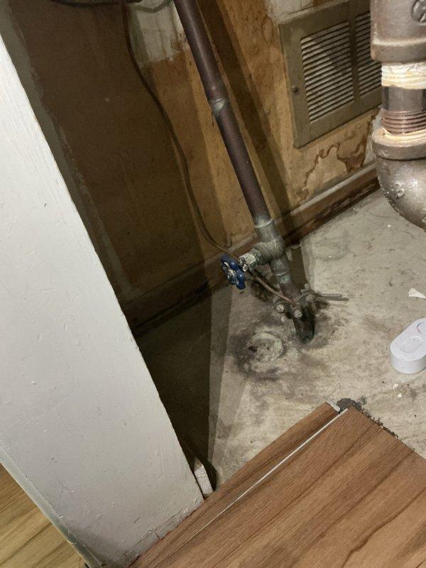 Replaced malfunctioning main water shut-off valve in basement utility area and repaired leaking outdoor spigot mounted on exterior wall. Both plumbing fixtures are now operating properly with no active leaks detected upon completion.