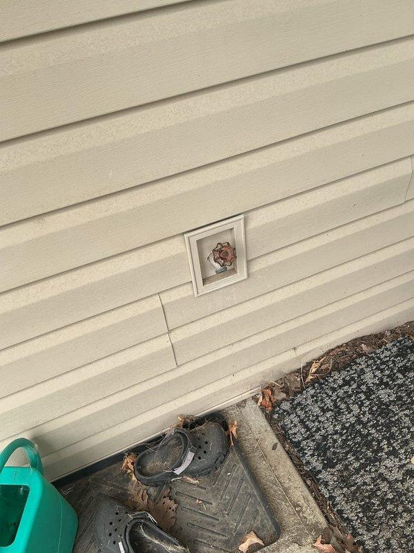 Replaced malfunctioning main water shut-off valve in basement utility area and repaired leaking outdoor spigot mounted on exterior wall. Both plumbing fixtures are now operating properly with no active leaks detected upon completion.